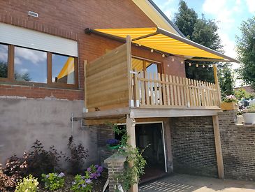 Knikarmschermen aan klassieke woningen