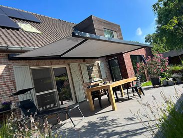 Knikarmschermen aan klassieke woningen
