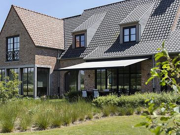 Knikarmschermen aan klassieke woningen