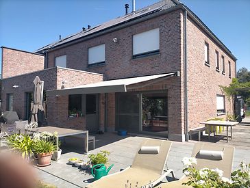 Knikarmschermen aan klassieke woningen