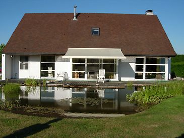 Knikarmschermen aan klassieke woningen