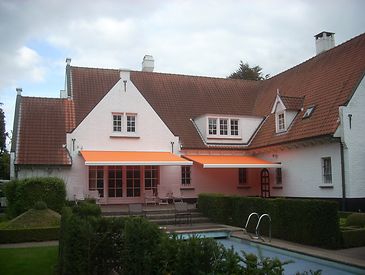 Knikarmschermen aan klassieke woningen