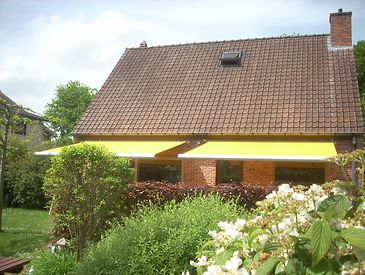 Knikarmschermen aan klassieke woningen