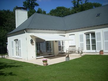 Knikarmschermen aan klassieke woningen